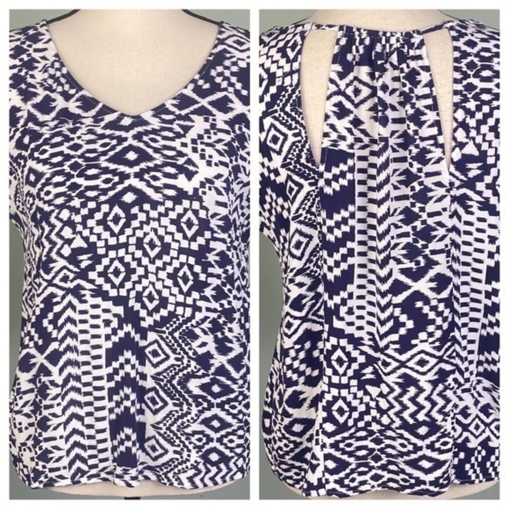 SKIES ARE BLUE navy and white top with back cut-outs in size Medium. EUC